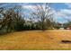 Large backyard with mature trees and open space at 1223 India Hook Rd, Rock Hill, SC 29732