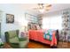 Charming bedroom with coral bedding and a green accent chair at 1223 India Hook Rd, Rock Hill, SC 29732