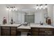 Double vanity bathroom with granite countertops and large mirror at 130 Portman Ln, Statesville, NC 28625