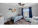 Cozy bedroom with two twin beds, ample natural light, and hardwood floors at 130 Portman Ln, Statesville, NC 28625