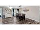 Bright dining room features a rustic farmhouse table with six chairs and hardwood floors at 130 Portman Ln, Statesville, NC 28625