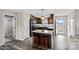 Eat-in kitchen with island, granite countertops, and dark wood cabinets at 130 Portman Ln, Statesville, NC 28625