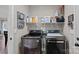 Laundry room with side-by-side washer and dryer and shelving for storage at 130 Portman Ln, Statesville, NC 28625