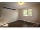 Bright bedroom with a large window and wood-look floors at 1419 Riverwood Ct, Rock Hill, SC 29732