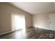 Living room with hardwood floors and sliding door to patio at 1419 Riverwood Ct, Rock Hill, SC 29732