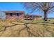 Brick home exterior featuring a nice backyard with a lovely mature tree at 1491 Black Hwy, York, SC 29745