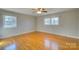 Well-lit bedroom, hardwood floors, and two windows at 1491 Black Hwy, York, SC 29745