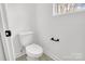 Small bathroom with toilet and window at 1510 Nectar Way, Kannapolis, NC 28027