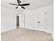 Bright bedroom with ceiling fan and double doors to closet at 1510 Nectar Way, Kannapolis, NC 28027