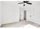 Bright bedroom with ceiling fan and double doors to closet at 1510 Nectar Way, Kannapolis, NC 28027