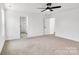 Bedroom with neutral carpet, ceiling fan and access to bathroom at 1510 Nectar Way, Kannapolis, NC 28027