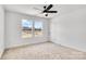 Bedroom with two windows, a ceiling fan and neutral carpet at 1520 Nectar Way, Kannapolis, NC 28027