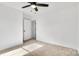 Bright bedroom with ceiling fan and neutral carpeting at 1520 Nectar Way, Kannapolis, NC 28027