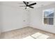 Bright bedroom featuring a ceiling fan and window view at 1520 Nectar Way, Kannapolis, NC 28027