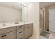 Elegant bathroom with dual vanities and a walk-in shower at 15209 Red Canoe Way, Charlotte, NC 28278