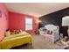 Adorable bedroom with a Mickey Mouse theme, featuring twin bed and crib at 15209 Red Canoe Way, Charlotte, NC 28278