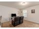 Relaxing game room featuring two comfy recliner chairs and entertainment center at 15209 Red Canoe Way, Charlotte, NC 28278