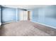 Bedroom with light blue walls and neutral carpeting at 15305 Colonial Park Dr, Huntersville, NC 28078