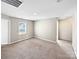 Neutral-toned bedroom with carpet and an exterior window at 15305 Colonial Park Dr, Huntersville, NC 28078