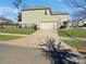 Side view of a two-story house with a garage and driveway at 15305 Colonial Park Dr, Huntersville, NC 28078