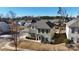 Two-story house with gray roof, green siding, and landscaping at 15305 Colonial Park Dr, Huntersville, NC 28078