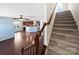 Staircase with wooden railing leading to the upper level at 15305 Colonial Park Dr, Huntersville, NC 28078