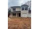 Two-story house with beige siding, gray accents, and a two-car garage at 1604 Lincoln Dr, Shelby, NC 28152