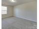 Spacious bedroom with carpet and a large window at 162 Four Andrews Dr, Harmony, NC 28634