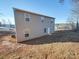 Rear view of a two-story house with gray siding and multiple windows at 162 Four Andrews Dr, Harmony, NC 28634