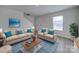 Living Room with beige sofas, coffee table, and teal pillows at 162 Four Andrews Dr, Harmony, NC 28634