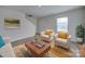 Living Room with beige sofas, coffee table, and a large window at 162 Four Andrews Dr, Harmony, NC 28634