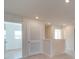 Upstairs hallway with doors to bedrooms and a linen closet at 162 Four Andrews Dr, Harmony, NC 28634