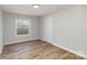 Light-filled bedroom featuring wood-look floors at 1762 Proposal Ave, Chester, SC 29706