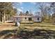 Single-story house with a deck and wooded lot at 1762 Proposal Ave, Chester, SC 29706