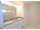 Double vanity bathroom with marble floor at 1819 Teachers House Nw Rd, Concord, NC 28027