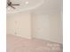 Spacious bedroom with neutral carpeting and ceiling fan at 1819 Teachers House Nw Rd, Concord, NC 28027