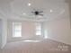 Main bedroom with neutral carpet, ceiling fan, and recessed lighting at 1819 Teachers House Nw Rd, Concord, NC 28027