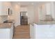 Open concept kitchen with island, stainless steel appliances, and white cabinets at 1819 Teachers House Nw Rd, Concord, NC 28027