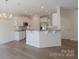 Open concept kitchen with island and stainless steel appliances at 1819 Teachers House Nw Rd, Concord, NC 28027