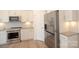 Stainless steel appliances and white cabinets in a spacious kitchen at 1819 Teachers House Nw Rd, Concord, NC 28027