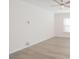 Bright and spacious living room with wood-look flooring and ceiling fan at 1819 Teachers House Nw Rd, Concord, NC 28027