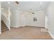 Spacious basement with carpeting, ceiling fan, and stairs at 182 Grand View Dr, New London, NC 28127