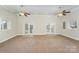 Spacious basement with carpeting and double doors at 182 Grand View Dr, New London, NC 28127