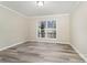 Bright bedroom with vinyl flooring and window at 182 Grand View Dr, New London, NC 28127