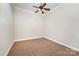 Simple carpeted bedroom with ceiling fan at 182 Grand View Dr, New London, NC 28127