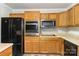 Kitchen with black refrigerator, oven, and cooktop at 182 Grand View Dr, New London, NC 28127