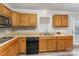 View of kitchen sink, dishwasher, and wood cabinets at 182 Grand View Dr, New London, NC 28127