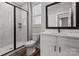 Modern bathroom featuring a glass shower, marble look tile, and white vanity at 1852 Yardley St, Rock Hill, SC 29732