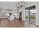 Open kitchen with white cabinets, stainless steel appliances, island, and sliding doors to patio at 1852 Yardley St, Rock Hill, SC 29732