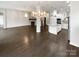 Open dining room with hardwood floors and kitchen island at 1924 Felts Pkwy, Fort Mill, SC 29715